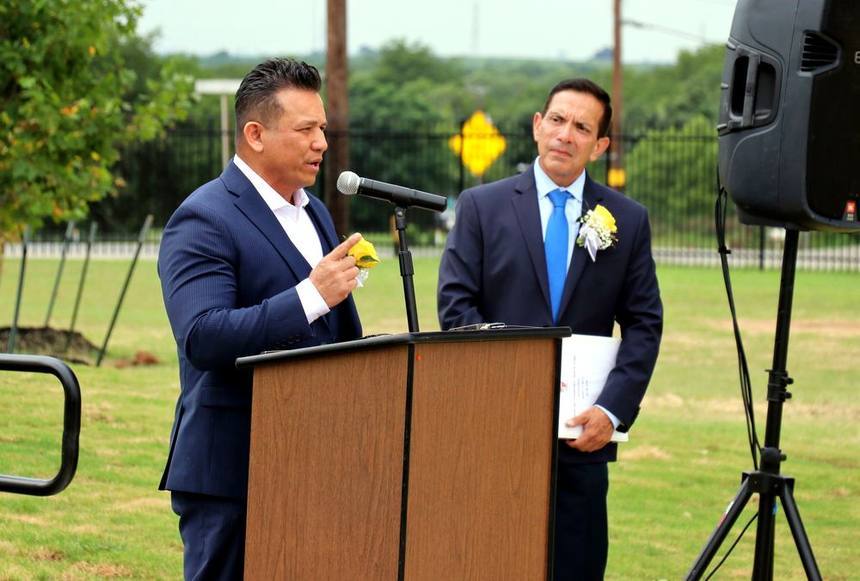 Willie speaking at a community podium