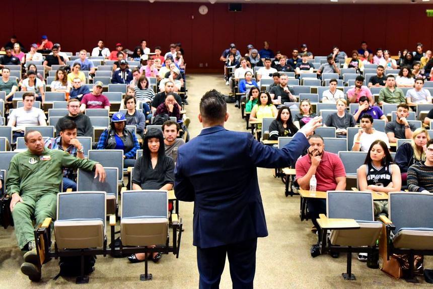 Willie speaking to a packed lecture hall